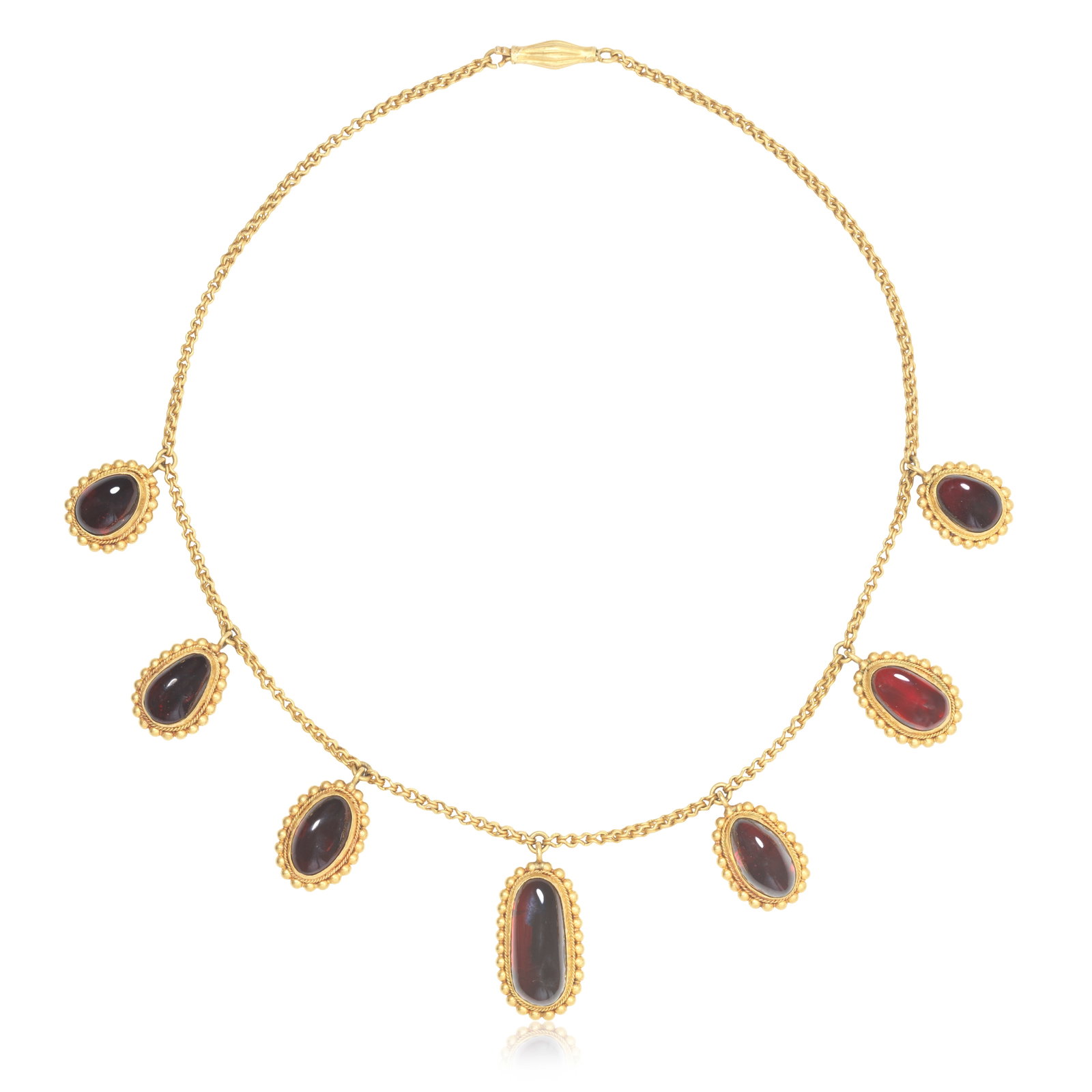GARNET NECKLACE: GARNET NECKLACE The fancy-link chain suspending seven oval and pear-shaped garnet cabochons graduating inwardly in size, length 38.0cm For further information on this lot please visit Bonhams.com
