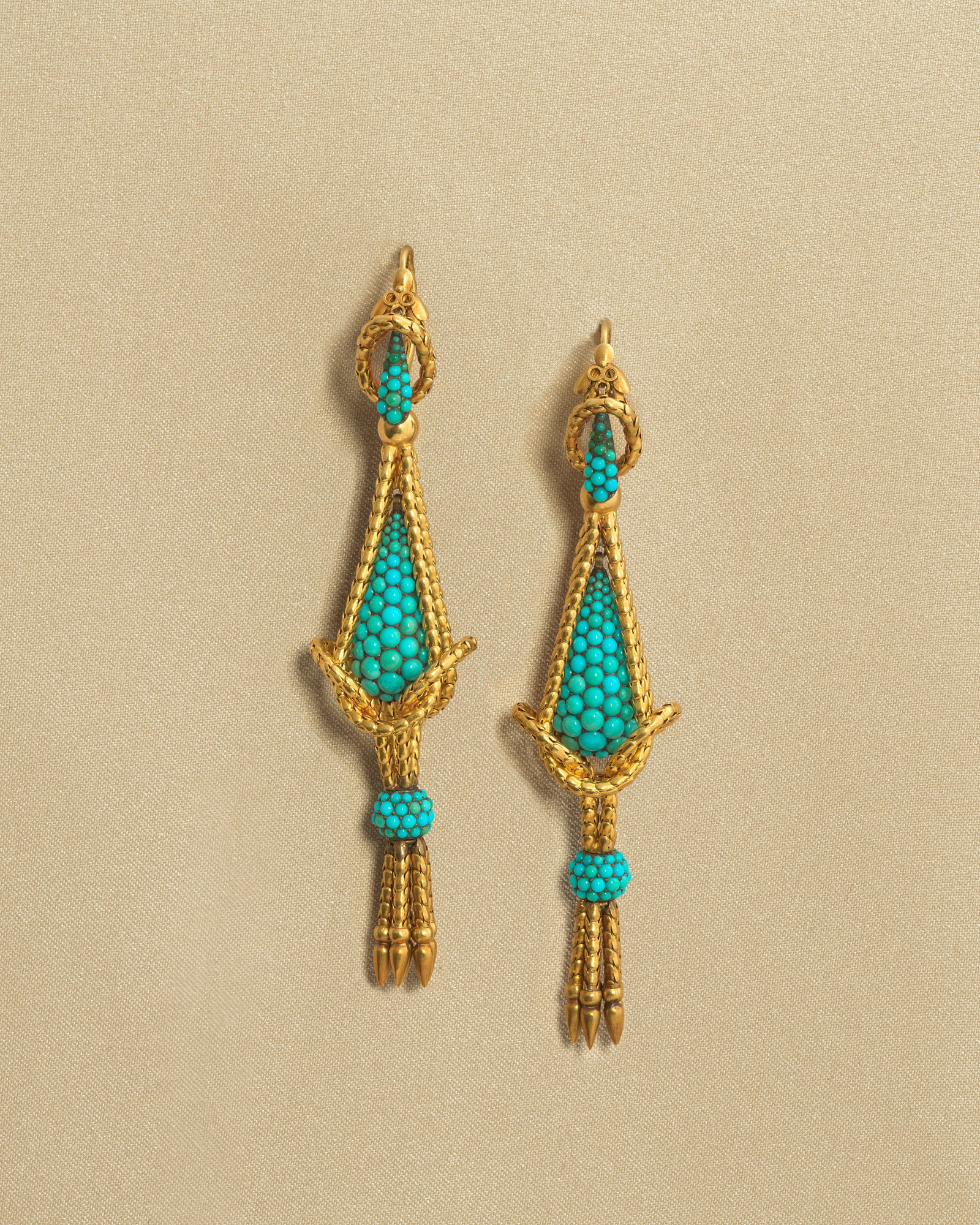 TURQUOISE PENDENT EARRINGS, CIRCA 1860: TURQUOISE PENDENT EARRINGS, CIRCA 1860 The articulated serpent-link, set with turquoise cabochons, issuing a similarly set tassel, terminating in gold pampilles, mounted in gold, length 9.5cm For