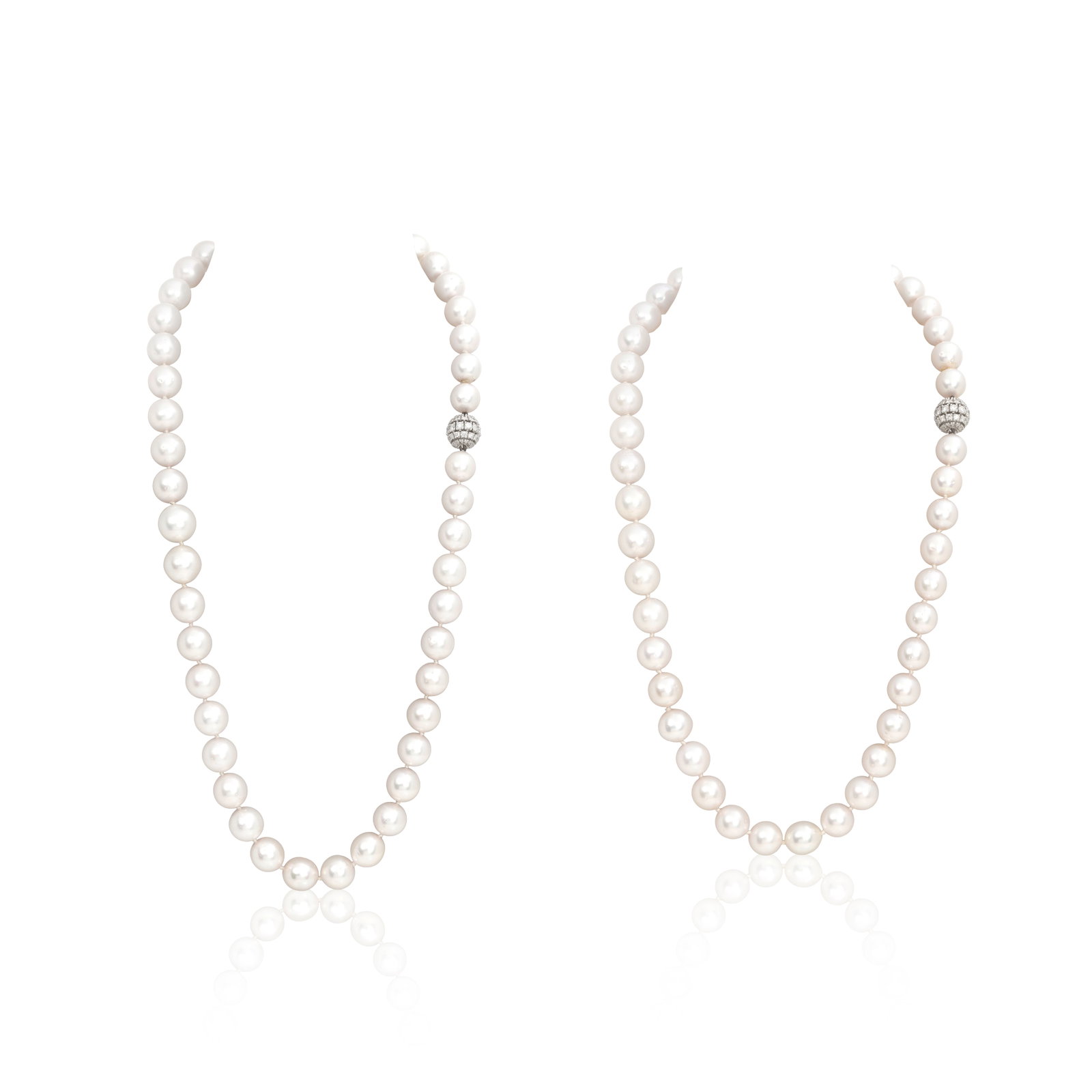 TWO CULTURED PEARL AND DIAMOND-SET NECKLACES: TWO CULTURED PEARL AND DIAMOND-SET NECKLACES Each row of 10.9-12.7mm cultured pearls to a bombé-style clasp of brilliant-cut diamonds, convertible to a longer necklace, diamonds approx. 4.25cts