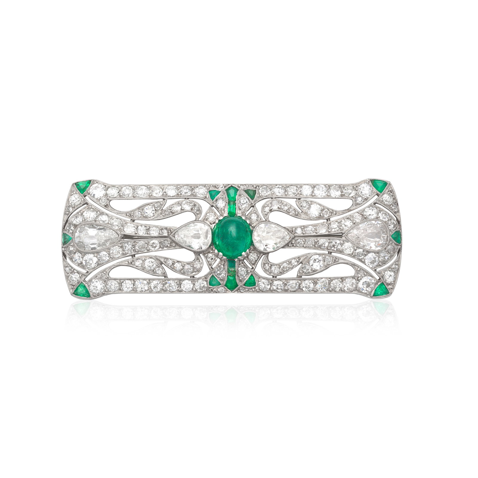 EMERALD AND DIAMOND BROOCH, CIRCA 1915: EMERALD AND DIAMOND BROOCH, CIRCA 1915 The openwork panel brooch centred by an emerald cabochon, set between four old pear-cut diamonds, the border and scrollwork set throughout with old brilliant-cut