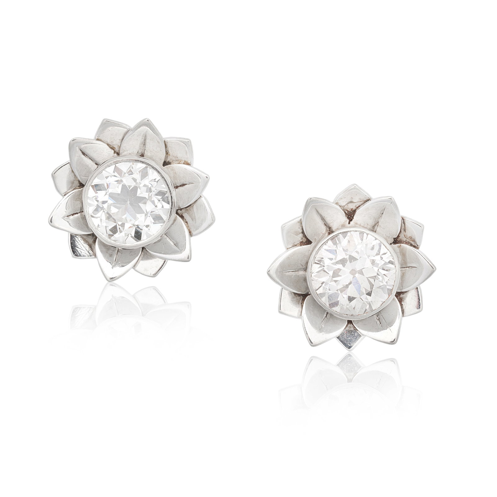 DIAMOND EARRINGS: DIAMOND EARRINGS Each old brilliant-cut diamond within a petal surround, diamonds very approx. 1.50cts total, length 1.2cm, cased by Nathan & Co., 31 Corporation St., Birmingham Footnotes: Please
