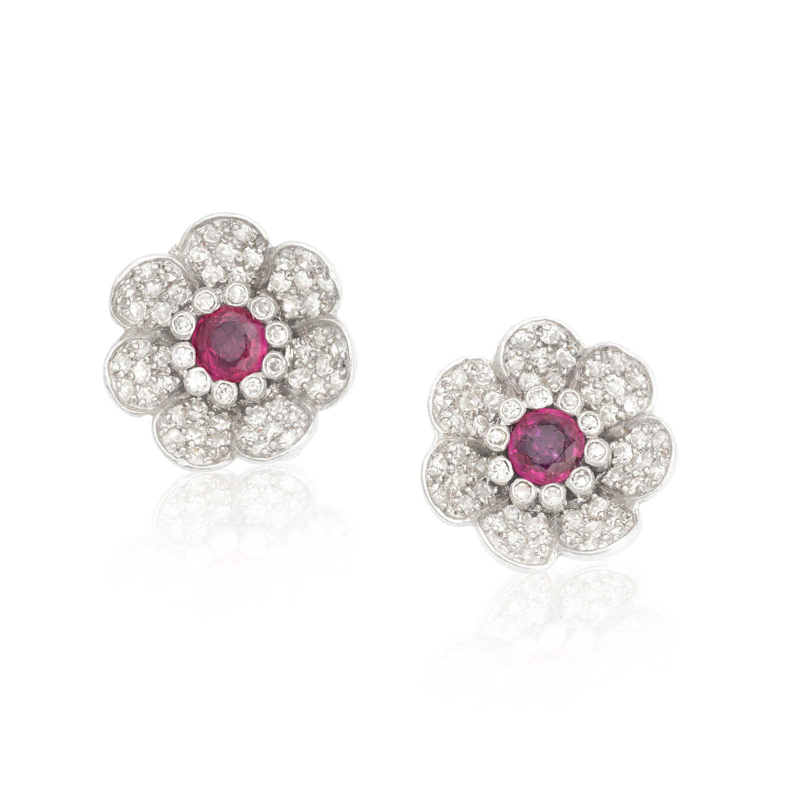 RUBY AND DIAMOND FLOWER EARRINGS: RUBY AND DIAMOND FLOWER EARRINGS Each with a circular-cut ruby to centre, surrounded by old brilliant and single-cut diamonds, diamonds approx. 0.60ct total, length 1.4cm For further information on