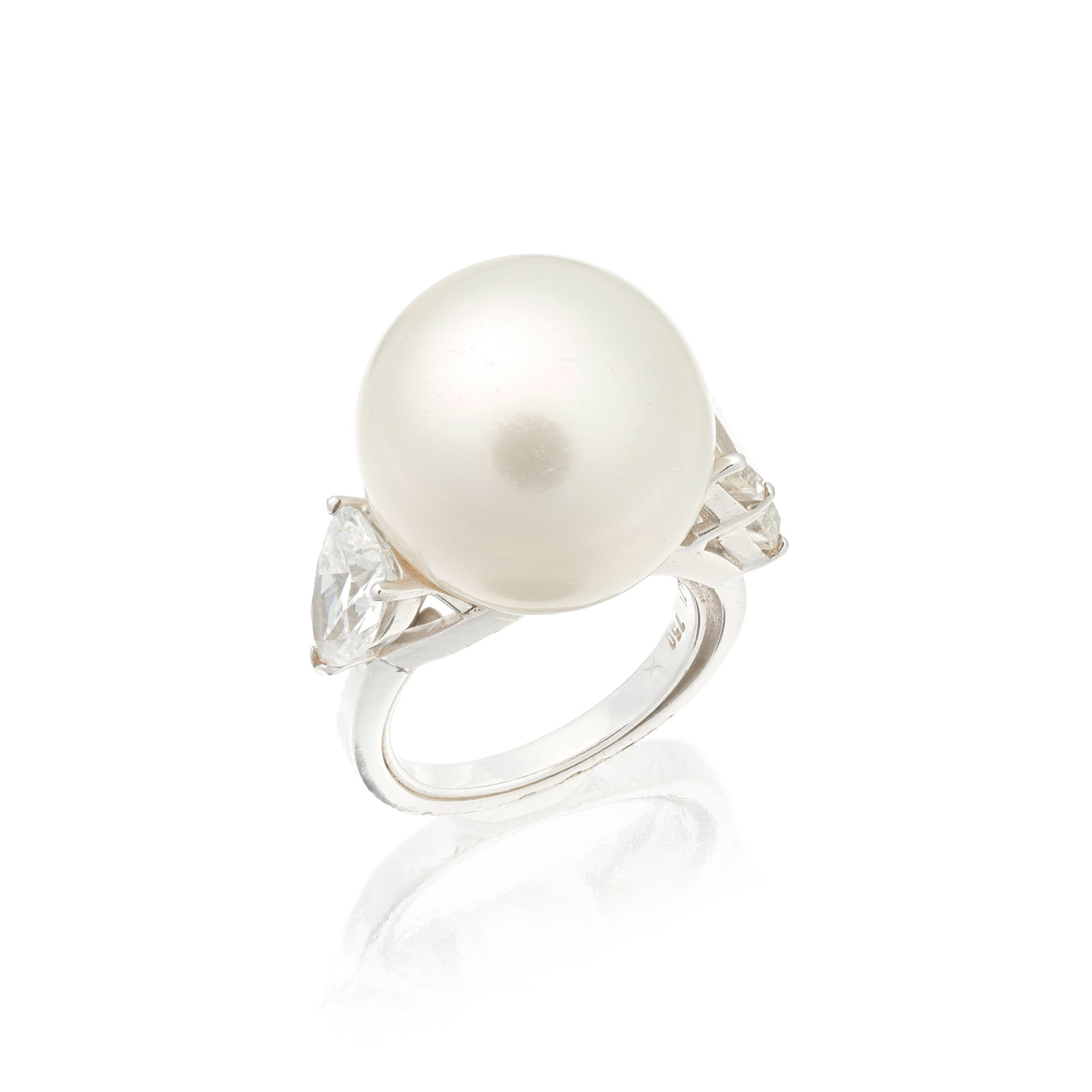 CULTURED PEARL AND DIAMOND RING: CULTURED PEARL AND DIAMOND RING The 16.9mm cultured pearl between diamond-set shoulders, one shoulder set with two step-cut diamonds, the other with a pear-cut diamond weighing 1.20 carats, ring size
