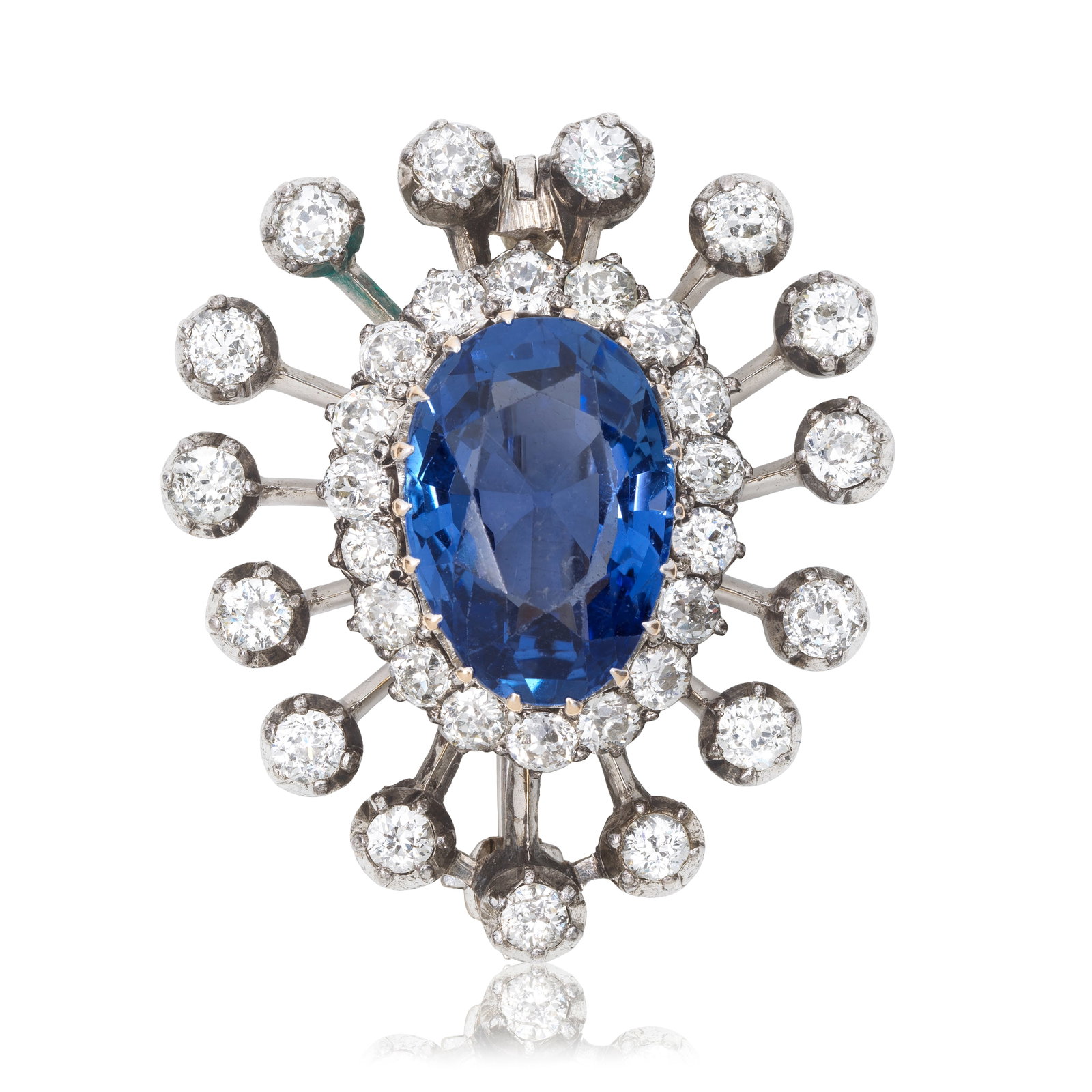 SAPPHIRE AND DIAMOND BROOCH, CIRCA 1900: SAPPHIRE AND DIAMOND BROOCH, CIRCA 1900 The pear-cut sapphire within a border of old brilliant-cut diamonds, issuing a radiating surround of similarly-cut diamonds, later brooch fitting, later