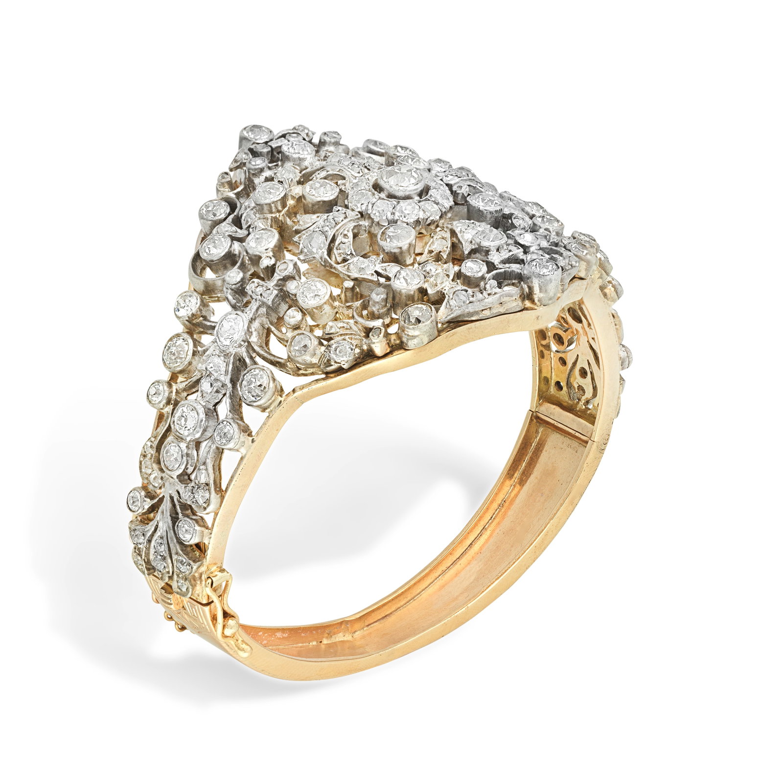 DIAMOND-SET BANGLE,: DIAMOND-SET BANGLE, CIRCA 1900 Of openwork design with cluster and scroll motifs set throughout with old brilliant and cushion-cut diamonds mounted in silver and gold, diamonds approx. 7.40cts total,