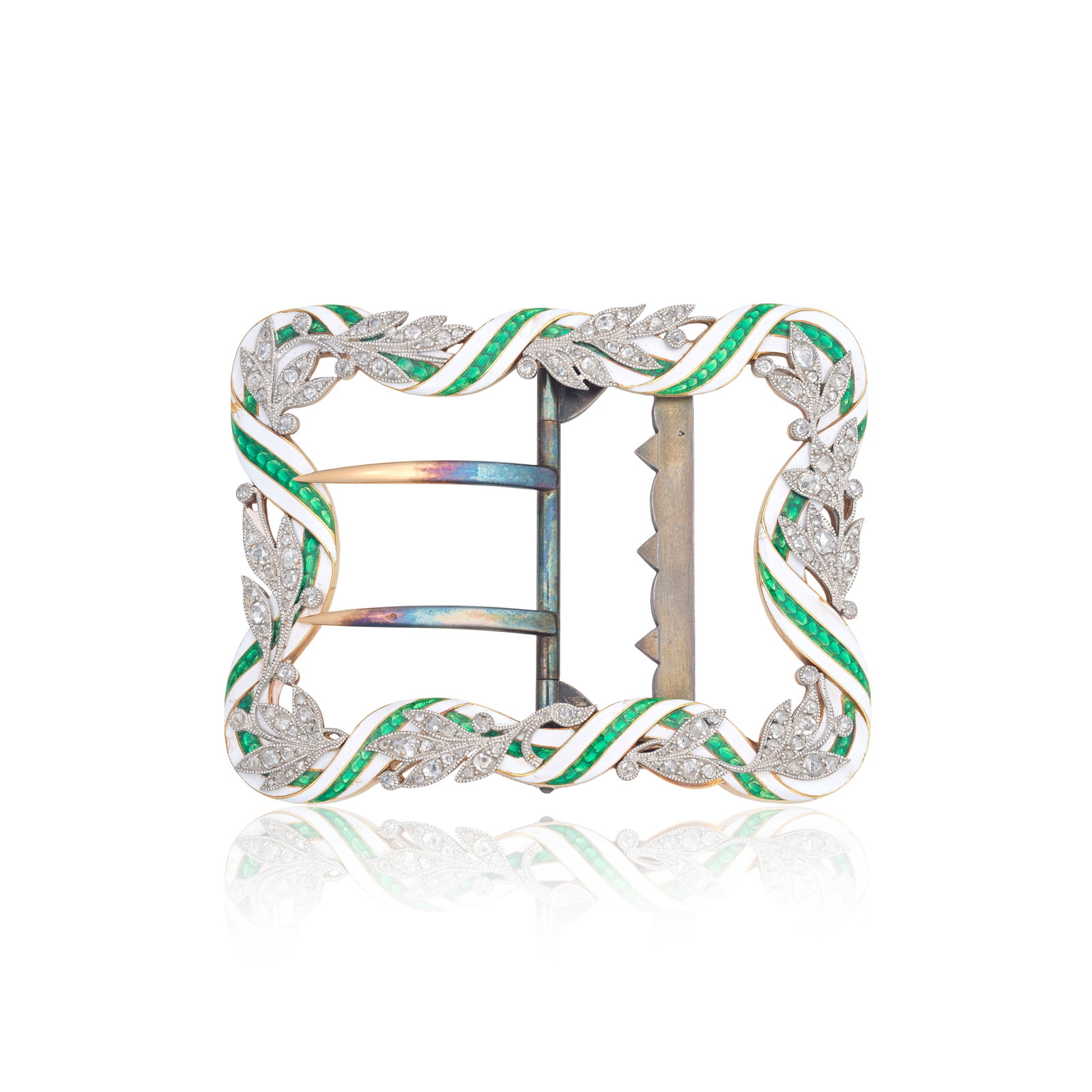 CARTIER: ENAMEL AND DIAMOND-SET BUCKLE, CIRCA 1905: CARTIER: ENAMEL AND DIAMOND-SET BUCKLE, CIRCA 1905 The scroll ribbon design of white and green enamel, accented by rose-cut diamond-set laurel leaves, mounted in gold and platinum, signed Cartier