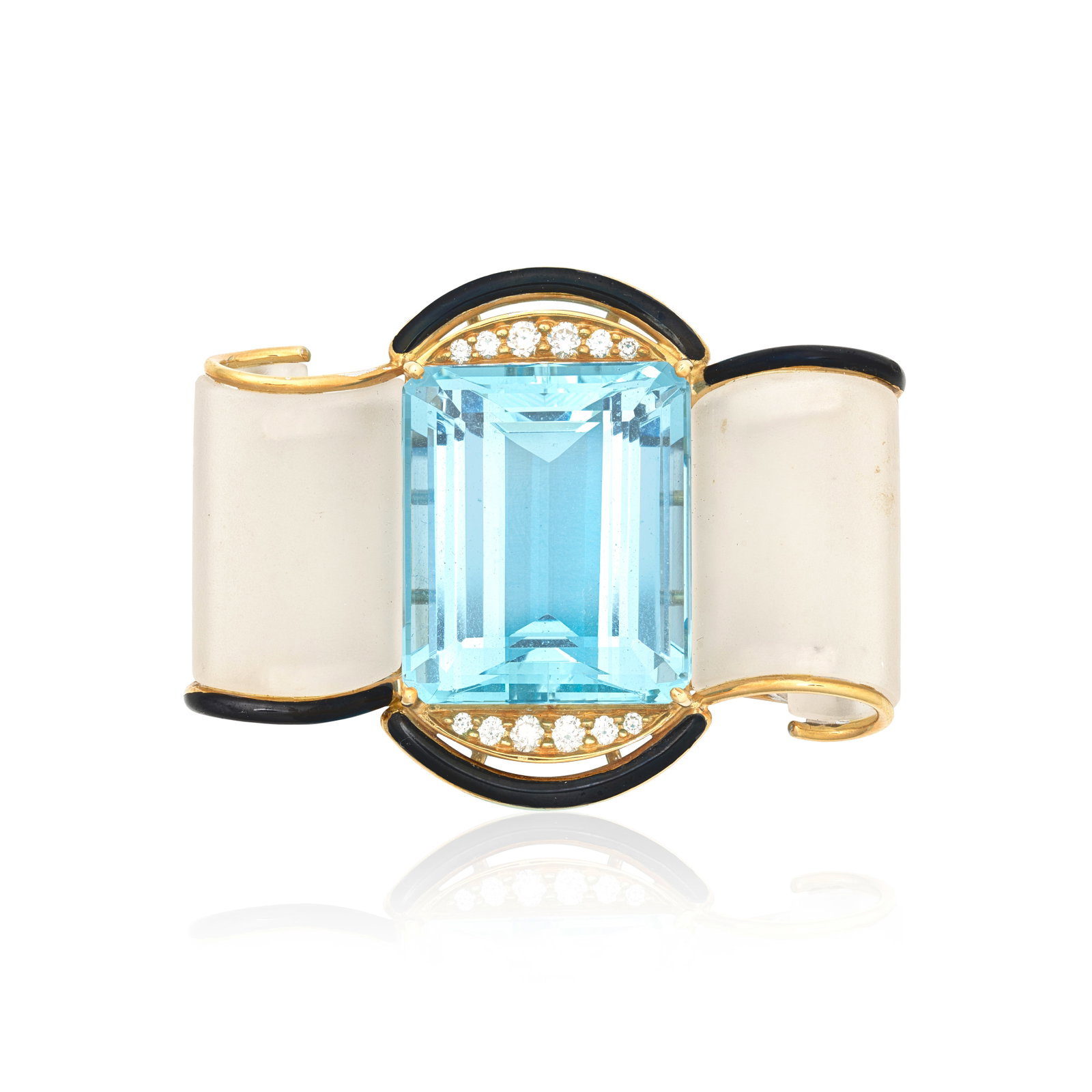 IVOR GORDON: AQUAMARINE, DIAMOND, QUARTZ AND ENAMEL BROOCH: IVOR GORDON: AQUAMARINE, DIAMOND, QUARTZ AND ENAMEL BROOCH The step-cut aquamarine accented by black enamel and brilliant-cut diamonds, between scrolled rock crystal, aquamarine approx. 44.00cts,
