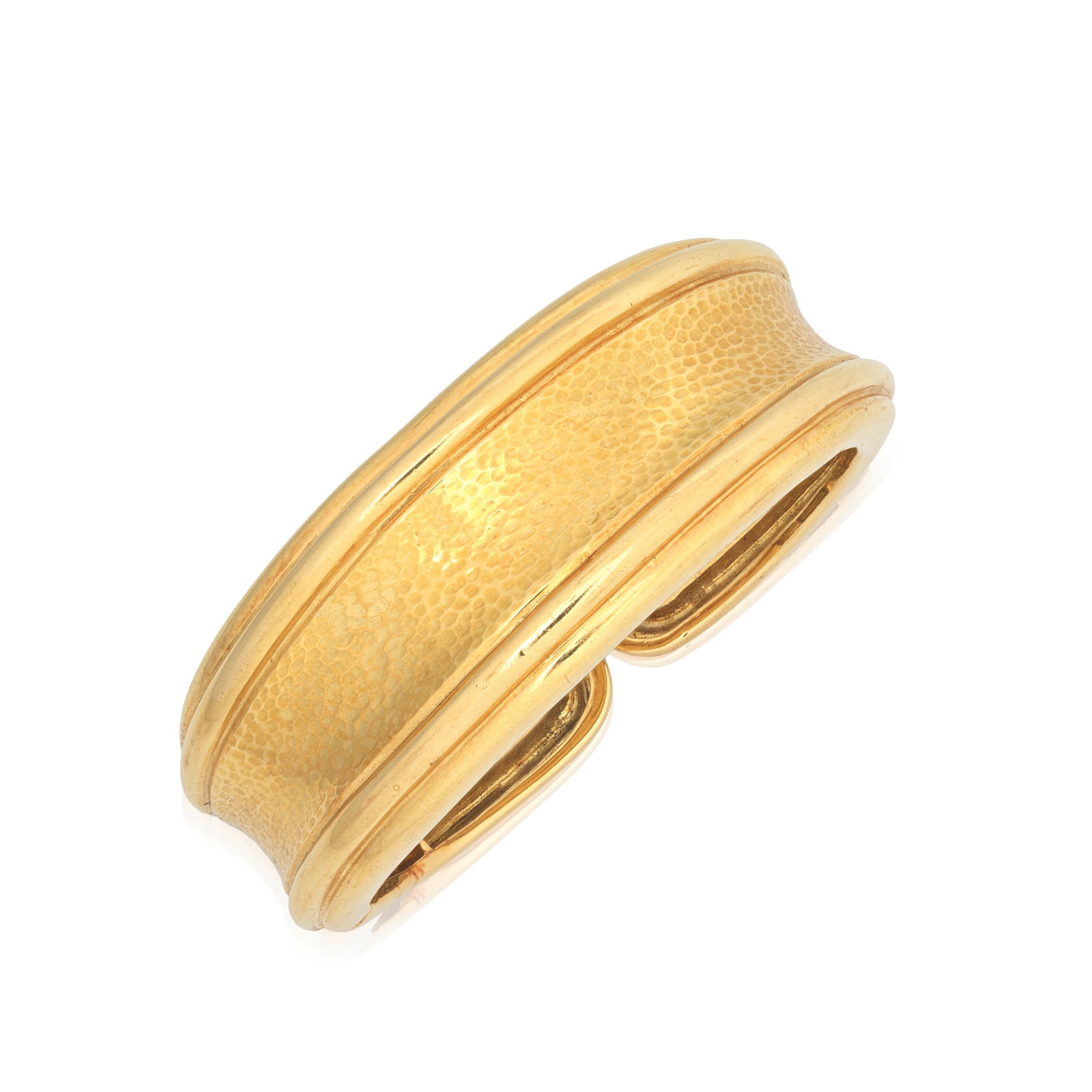 ANDREW CLUNN: BANGLE: ANDREW CLUNN: BANGLE Of hammered finish to a polished reeded outline, signed A.Clunn, inner circumference approx. 15.5cm Footnotes: Property from a Private Collection Lots 181 - 198 A note on Andrew