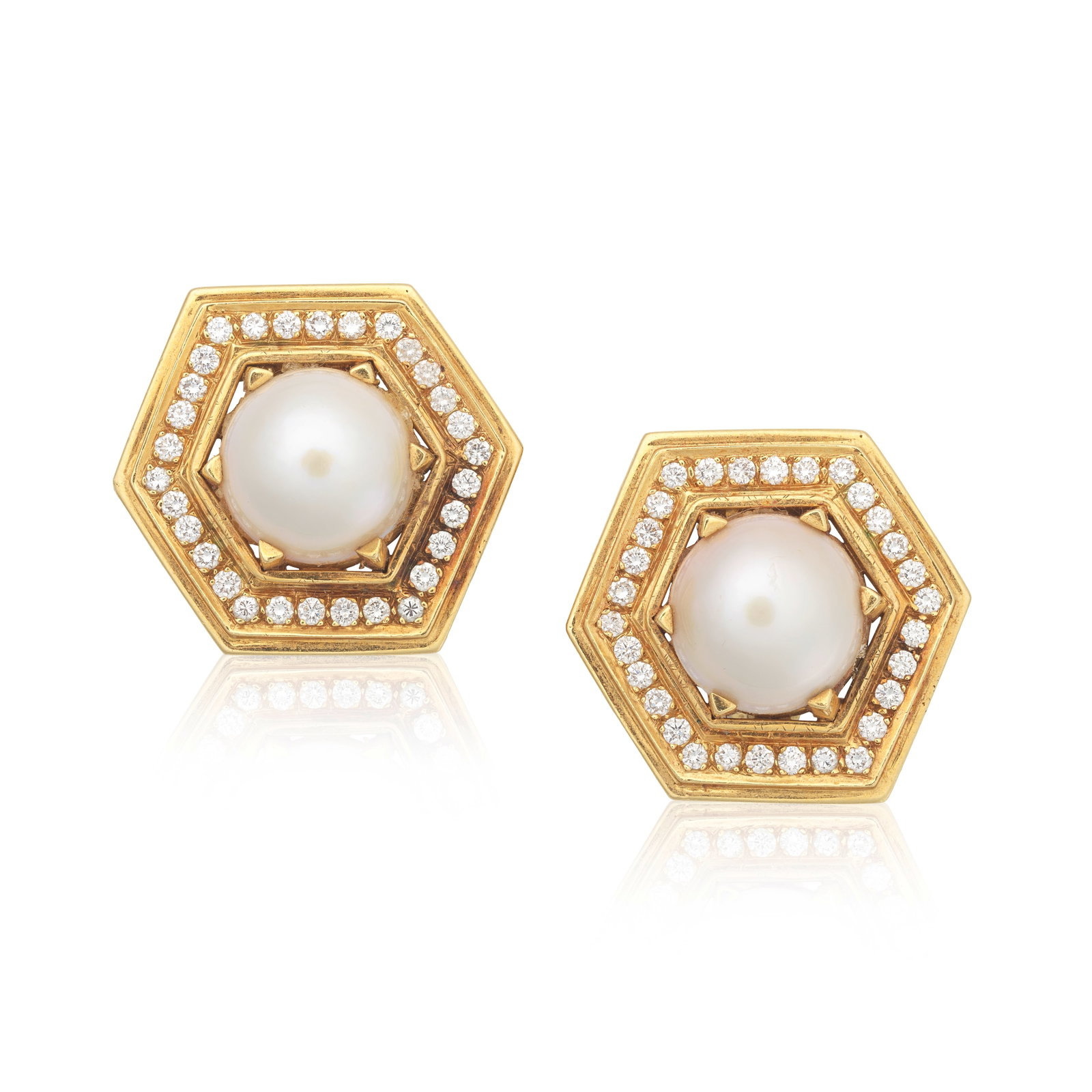CULTURED PEARL AND DIAMOND EARCLIPS: CULTURED PEARL AND DIAMOND EARCLIPS Each mabé cultured pearl within a brilliant-cut diamond hexagonal border, diamonds approx. 1.20cts total, length 3.0cm Footnotes: Property from a Private