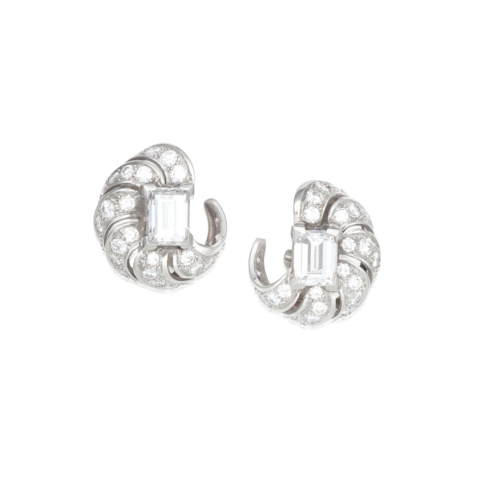 DIAMOND EARCLIPS, CIRCA 1940: DIAMOND EARCLIPS, CIRCA 1940 Each step-cut diamond weighing 2.09 and 2.44 carats, within a scrolled openwork surround set with brilliant-cut diamonds, length 2.0cm For further information on this lot 