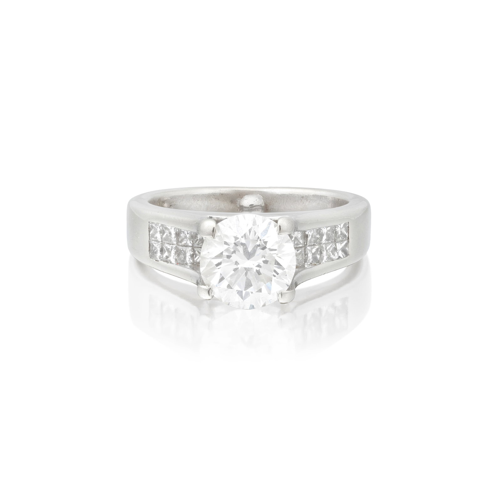 DIAMOND SINGLE-STONE RING: DIAMOND SINGLE-STONE RING The brilliant-cut diamond weighing 1.63 carats, to a gallery of princess-cut diamonds, ring size approx. E (sizing bead) Footnotes: HRD: 1.63 carats, E colour, VVS1 clarity. 