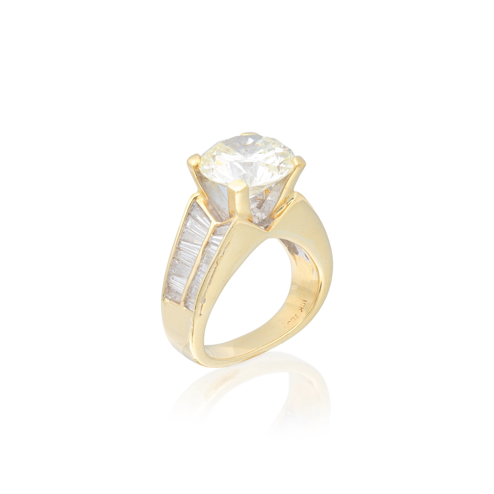 DIAMOND SINGLE-STONE RING: DIAMOND SINGLE-STONE RING The brilliant-cut diamond weighing 5.23 carats, to a tapered baguette-cut diamond surround, remaining diamonds approx. 1.20cts total, ring size approx. J For further informat