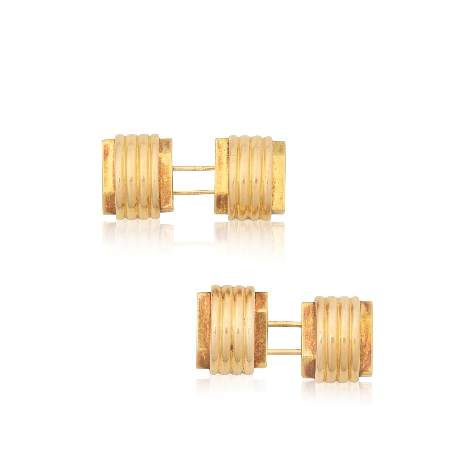 RENÉ BOIVIN: CUFFLINKS, CIRCA 1935: RENÉ BOIVIN: CUFFLINKS, CIRCA 1935 Double-sided: each faceted plaque with a central curved panel with reeded detail, unsigned, French assay marks, plaque dimensions 1.3cm x 1.0cm Footnotes: