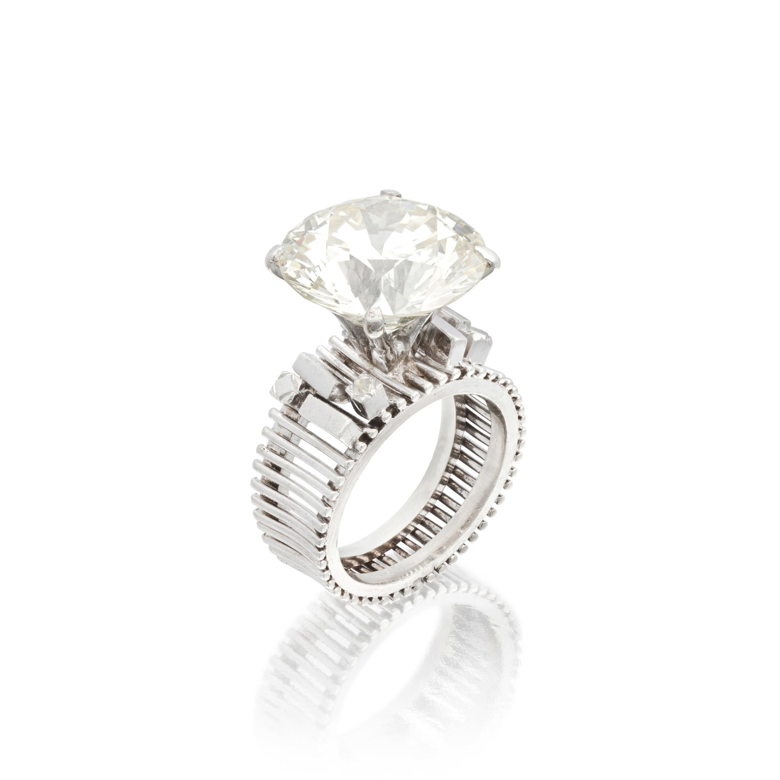 DIAMOND SINGLE-STONE RING: DIAMOND SINGLE-STONE RING The brilliant-cut diamond, weighing 11.65 carats, in a wirework setting with geometric shoulders, ring size approx. I½, cased by 'Kevin' of Singapore For further informa