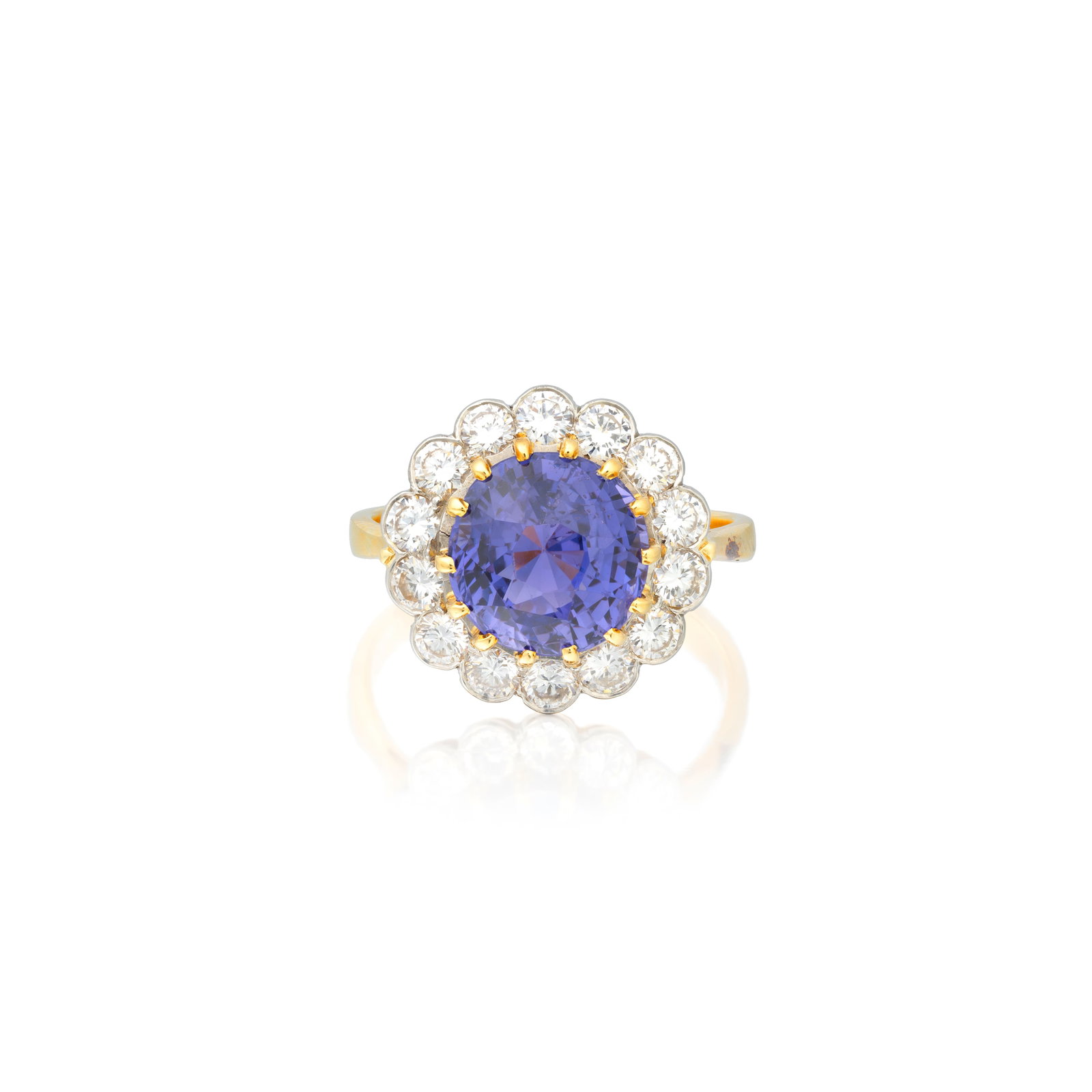 COLOUR CHANGE SAPPHIRE AND DIAMOND CLUSTER RING: COLOUR CHANGE SAPPHIRE AND DIAMOND CLUSTER RING The circular-cut colour-change sapphire set to a surround of brilliant-cut diamonds, colour-change sapphire weighing approx. 6.00cts, ring size approx.