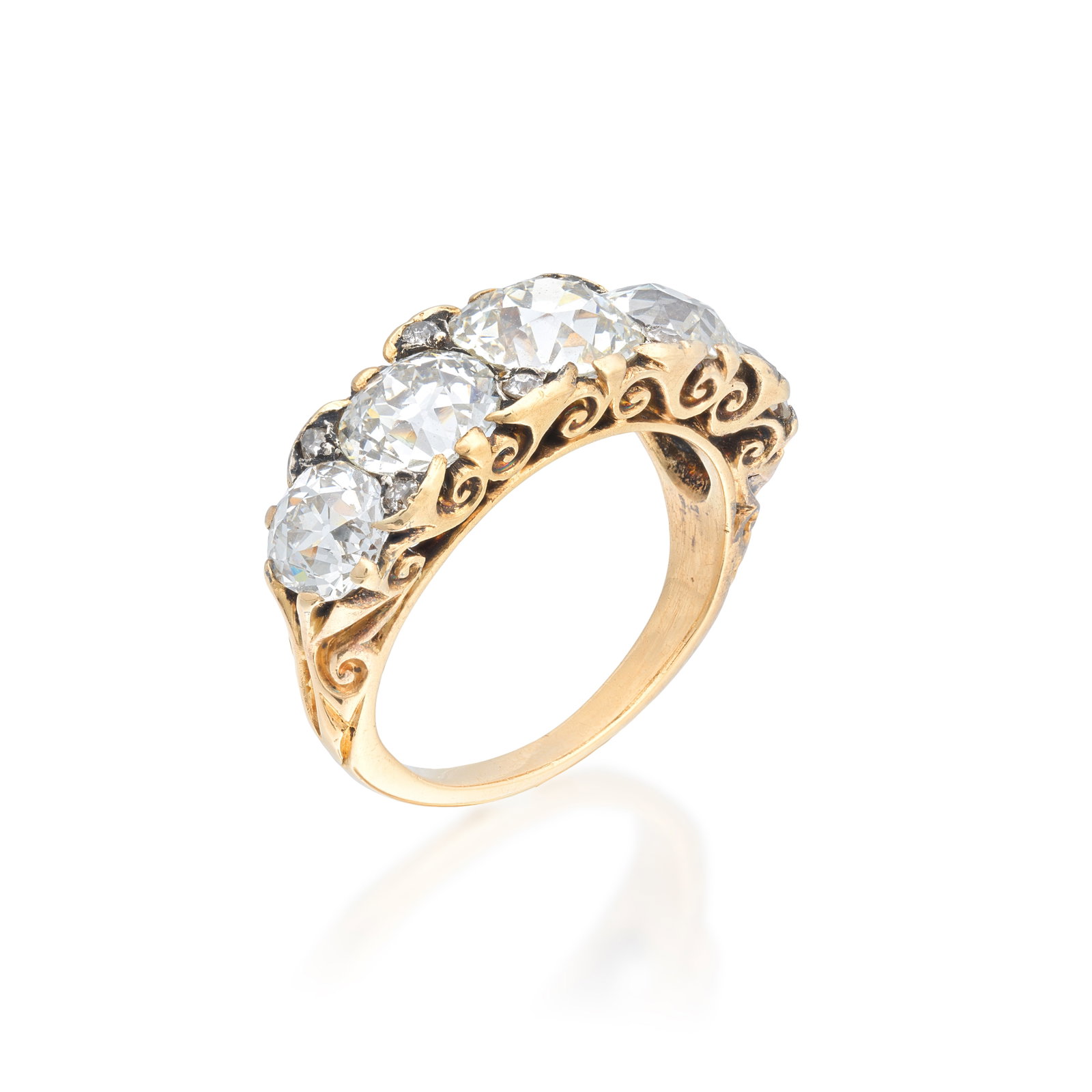 DIAMOND FIVE-STONE RING, CIRCA 1900: DIAMOND FIVE-STONE RING, CIRCA 1900 The graduating old brilliant-cut diamonds set to a carved scroll gallery, mounted in gold, principal diamond approx. 1.60cts, remaining diamonds approx. 2.50cts tot