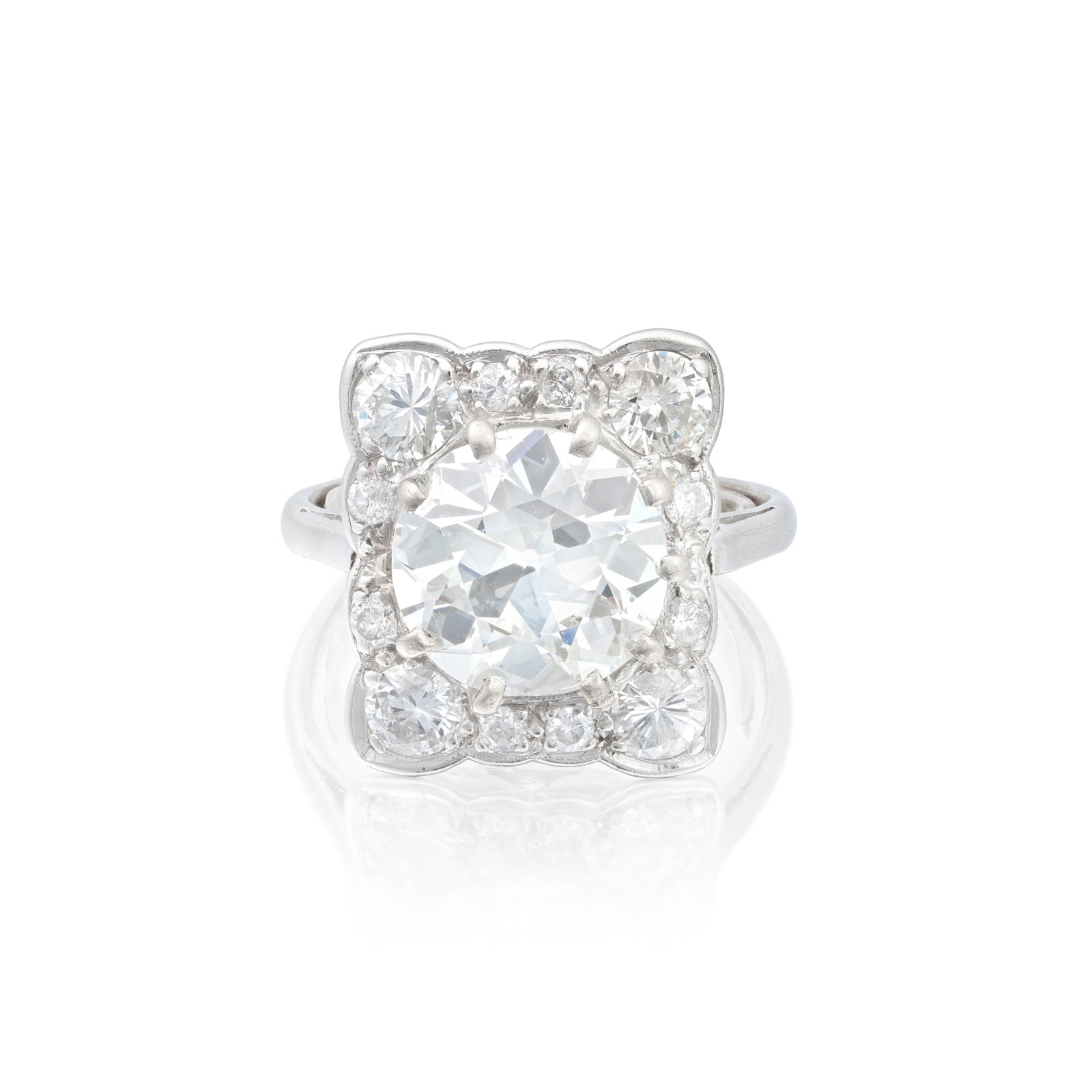 DIAMOND CLUSTER RING: DIAMOND CLUSTER RING The principal old brilliant-cut diamond weighing 3.58 carats, to a surround of brilliant-cut diamonds, remaining diamonds approx. 1.10cts total, ring size approx. K (sizing band) 