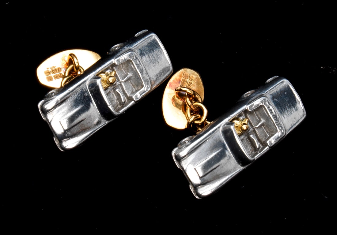 A pair of limited edition Aston Martin HRH DB6 Volante cufflinks, made from original metal from ...: A pair of limited edition Aston Martin HRH DB6 Volante cufflinks, made from original metal from then Prince Charles' personal Aston Martin, manufactured by TMB ArtMetal, the cufflinks made from the or