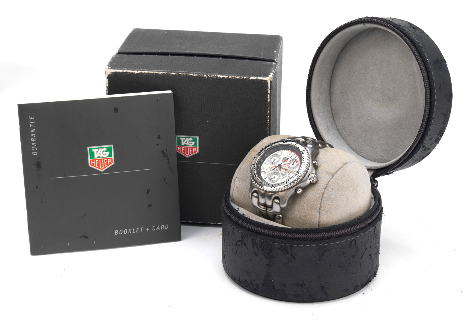 A cased Tag Heuer SEL 'West McLaren Mercedes 98' limited edition wristwatch, 1998,: A cased Tag Heuer SEL 'West McLaren Mercedes 98' limited edition wristwatch, 1998, (Ref.No.CG1117), stainless steel case, 37mm, silvered dial with three subsidiary dials and date window, Swiss quartz 