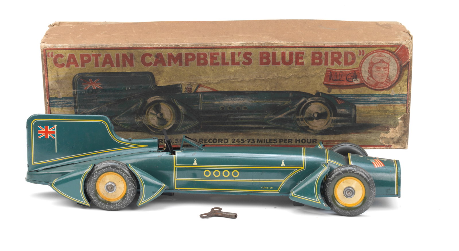 A boxed 'Captain Campbell's Blue Bird' clockwork tin-plate Land Speed Record toy by Gunthermann,...: A boxed 'Captain Campbell's Blue Bird' clockwork tin-plate Land Speed Record toy by Gunthermann, German, circa 1931, lithographed tin-plate toy in blue with yellow striping, depicting Malcolm Campbell