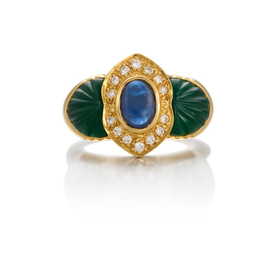 18K YELLOW GOLD, SAPPHIRE, CHALCEDONY, AND DIAMOND RING: 18K YELLOW GOLD, SAPPHIRE, CHALCEDONY, AND DIAMOND RING • One oval cabochon sapphire measuring approximately 7.30mm x 5.18mm x 3.17mm • Two carved chalcedony pieces measuring