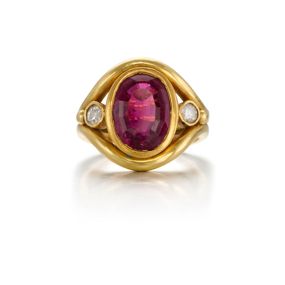AN 18K GOLD, TOURMALINE AND DIAMOND RING: AN 18K GOLD, TOURMALINE AND DIAMOND RING • One oval-shaped tourmaline weighing approximately 3.65 carats total • One round shaped and one old European-cut diamonds weighing approximately