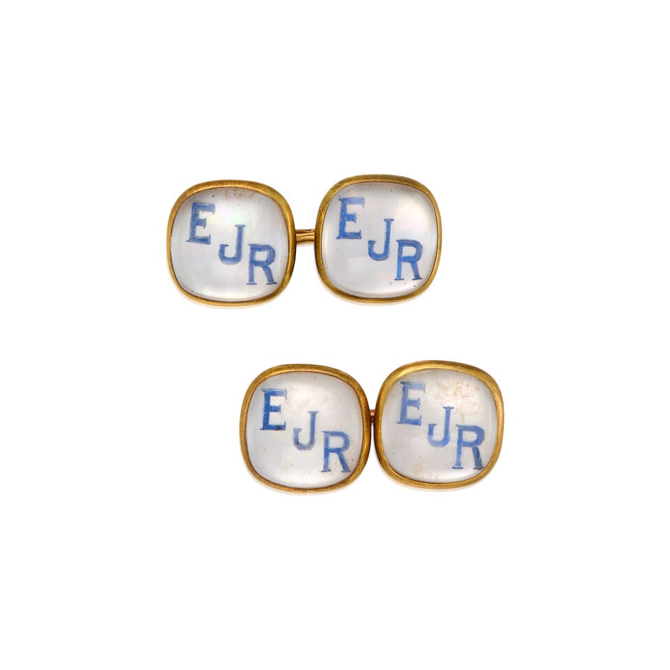 CARTIER: 14K YELLOW GOLD, ROCK CRYSTAL, MOTHER OF PEARL, AND ENAMEL CUFFLINKS: CARTIER: 14K YELLOW GOLD, ROCK CRYSTAL, MOTHER OF PEARL, AND ENAMEL CUFFLINKS • Mother of pearl backing, enamel letters, and rock crystal measuring approximately 13.12mm x 13.12mm •