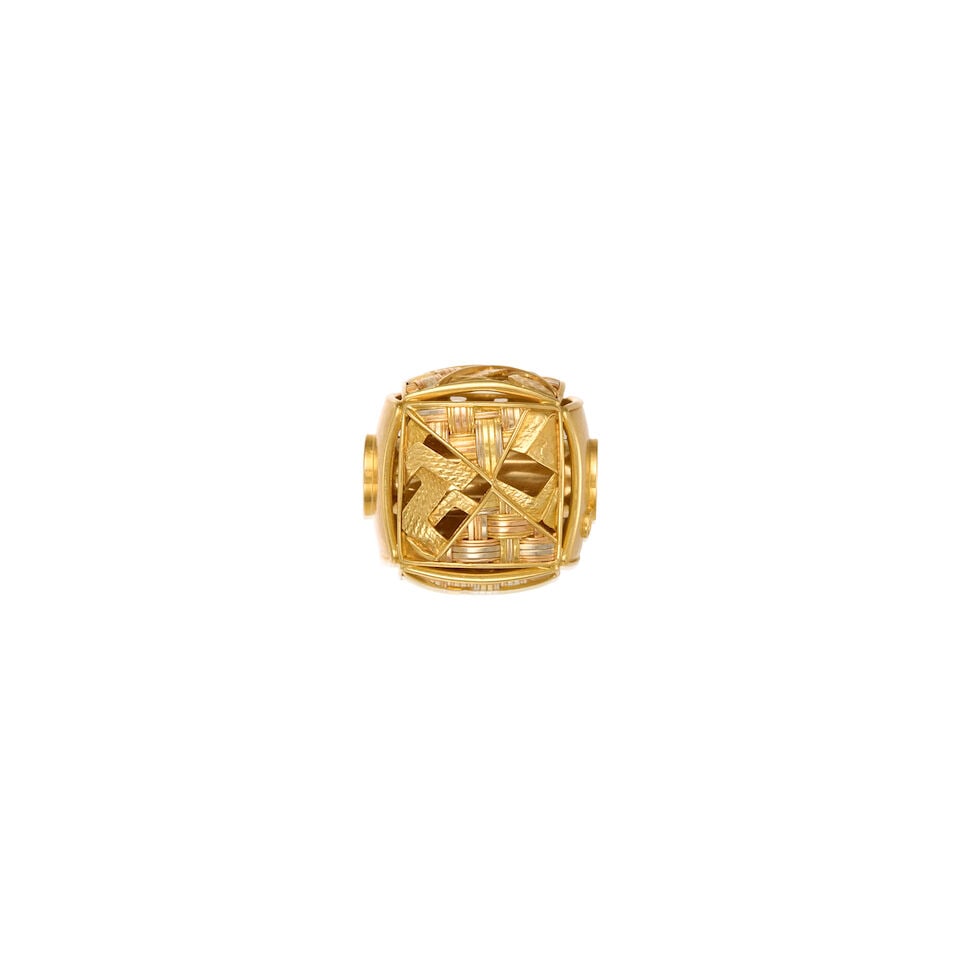 18K GOLD PENDANT ENHANCER: 18K GOLD PENDANT ENHANCER • 18K yellow and white gold • Measures 9/16 in. x 9/16 in. • Estimated gross weight: 7.1 grams Footnotes: Tuulikki Suominen Wolff was a Finnish dancer,