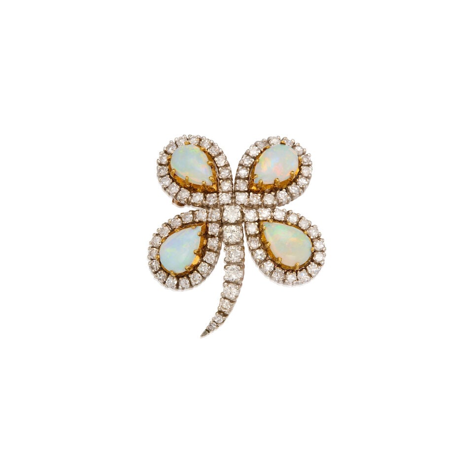 A GOLD, OPAL AND DIAMOND BROOCH: A GOLD, OPAL AND DIAMOND BROOCH • 14K white and yellow gold • Four pear-shaped opals weighing approximately 2.35 carats total • Sixty-four round single-cut and eight round