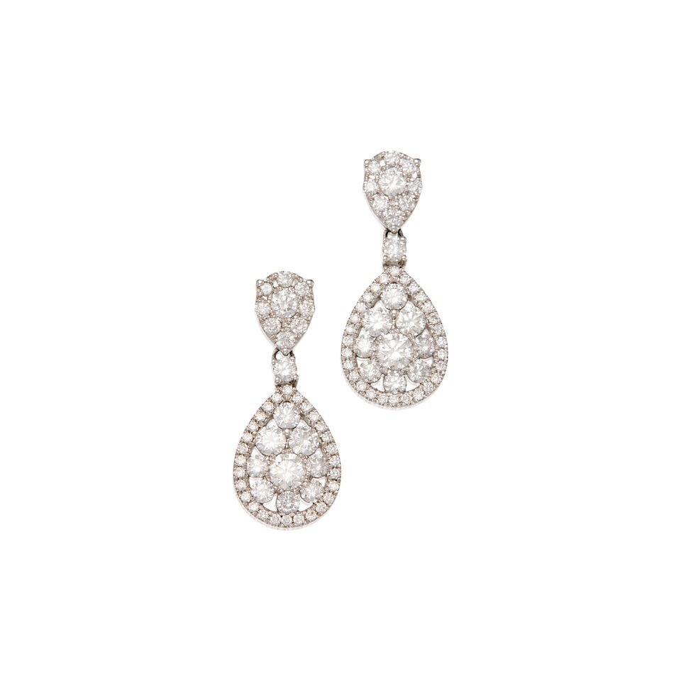18K WHITE GOLD AND DIAMOND EARRINGS: 18K WHITE GOLD AND DIAMOND EARRINGS • Numerous round shaped diamonds weighing approximately 1.30 carats total • Measures 1 in. x 7/16 in. • Estimated gross weight: 4.1