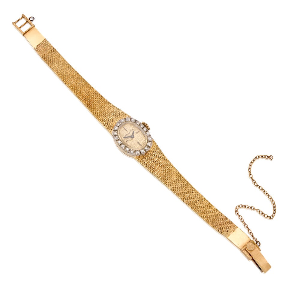 14K YELLOW GOLD AND DIAMOND WRISTWATCH: 14K YELLOW GOLD AND DIAMOND WRISTWATCH • 14K yellow gold watch case and bracelet • Twenty round shaped diamonds weighing approximately 0.20 carat total • Signed MATHEY TISSOT on the
