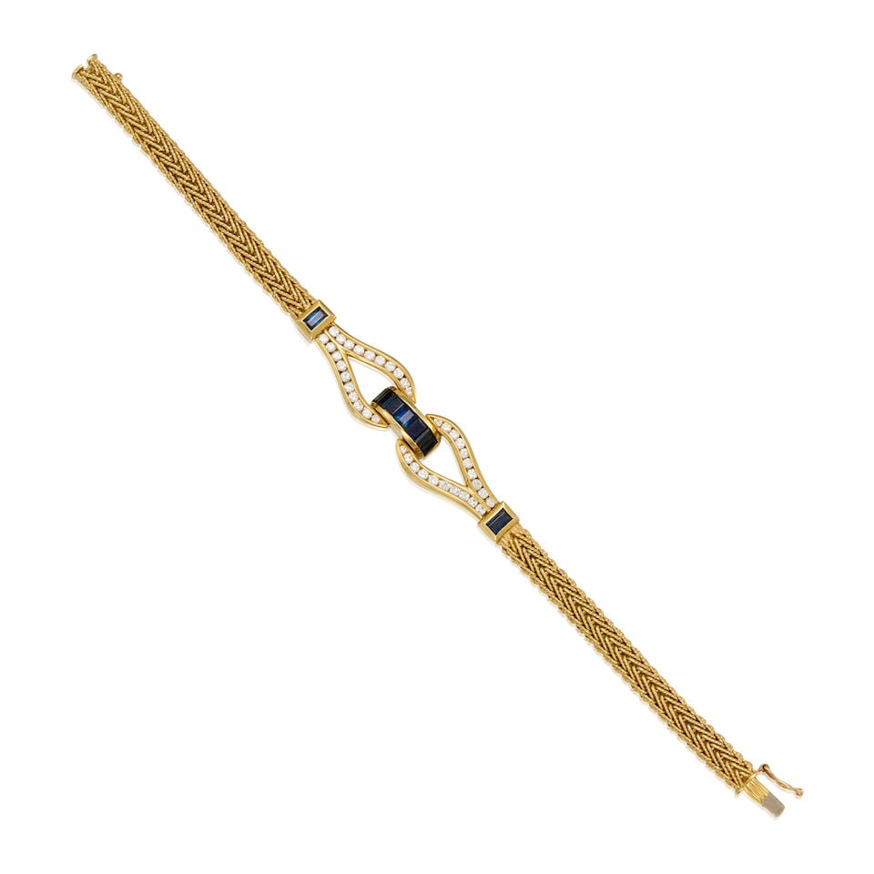 14K YELLOW GOLD, SAPPHIRE, AND DIAMOND BRACELET: 14K YELLOW GOLD, SAPPHIRE, AND DIAMOND BRACELET • Nine rectangular shaped sapphires weighing approximately 0.70 carat total • Numerous round shaped diamonds weighing approximately 0.40