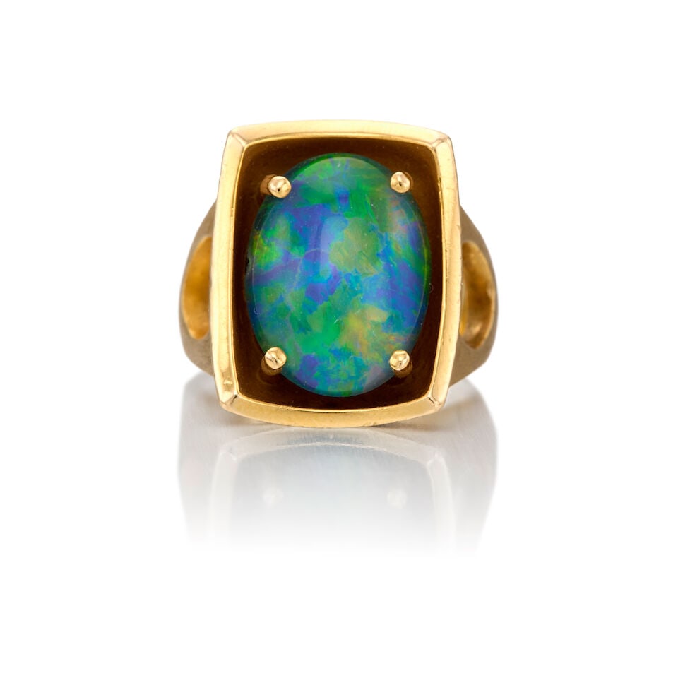 14K YELLOW GOLD AND OPAL DOUBLET RING: 14K YELLOW GOLD AND OPAL DOUBLET RING • An oval opal doublet measuring approximately 16.60mm x 12.17mm x depth cannot be determined due to the setting • Size 6 3/4 • Estimated gross