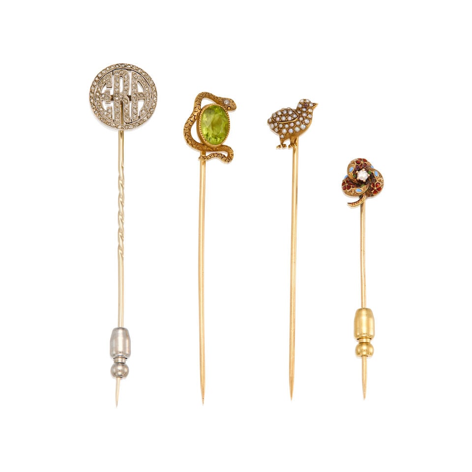 FOUR ANTIQUE GEMSET STICKPINS: FOUR ANTIQUE GEMSET STICKPINS • One 14K and 16K yellow gold stick pin with an oval shaped peridot measuring approximately 8.15mm x 6.26mm, one round shaped melee diamond, length 2 9/16 in. ̶