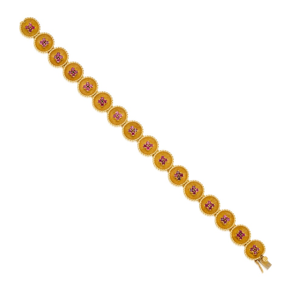 AN 18K GOLD AND RUBY BRACELET: AN 18K GOLD AND RUBY BRACELET • Sixty-four round-shaped rubies weighing approximately 1.47 carats total • Partial maker's mark present • Length 7 in. • Estimated gross weight: