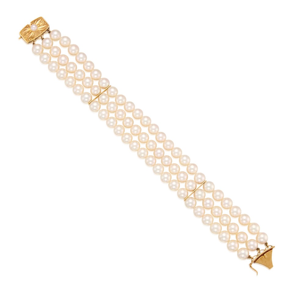 MIKIMOTO: 18K YELLOW GOLD AND CULTURED PEARL BRACELET: MIKIMOTO: 18K YELLOW GOLD AND CULTURED PEARL BRACELET • Numerous cultured pearls on three strands measuring approximately 4.09mm to 6.12mm in diameter • With maker's mark for Mikimoto