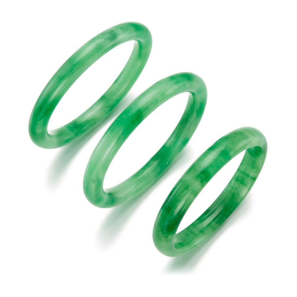A GROUP OF THREE JADE BANGLES (1 of 2)