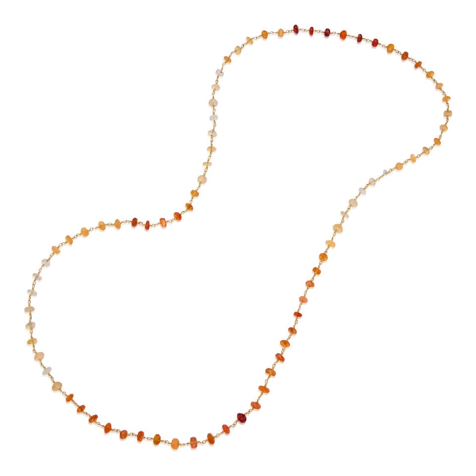18K YELLOW GOLD AND OPAL NECKLACE: 18K YELLOW GOLD AND OPAL NECKLACE • Numerous round, drilled, and faceted opal beads measuring approximately 5.15mm to 6.15mm in diameter • Length 15 in. with no clasp • Estimated