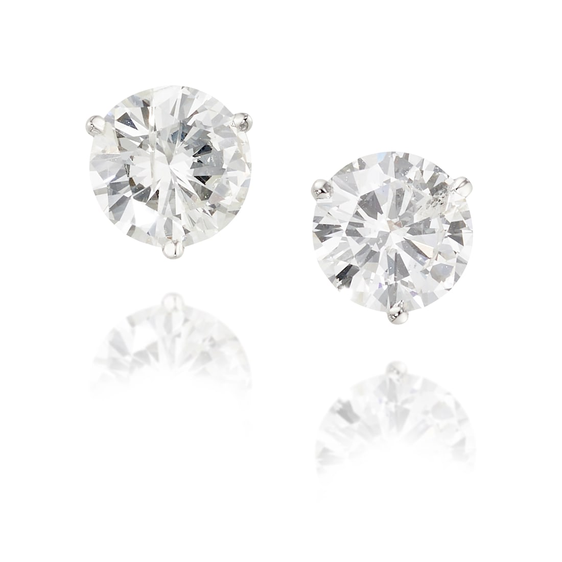 A PAIR OF 14K WHITE GOLD AND DIAMOND EARRINGS: A PAIR OF 14K WHITE GOLD AND DIAMOND EARRINGS Each comprising single round brilliant-cut diamonds; estimated diamond weights 1.45 carats each; measures 5/16 in. Footnotes: OVERALL CONDITION: Metal