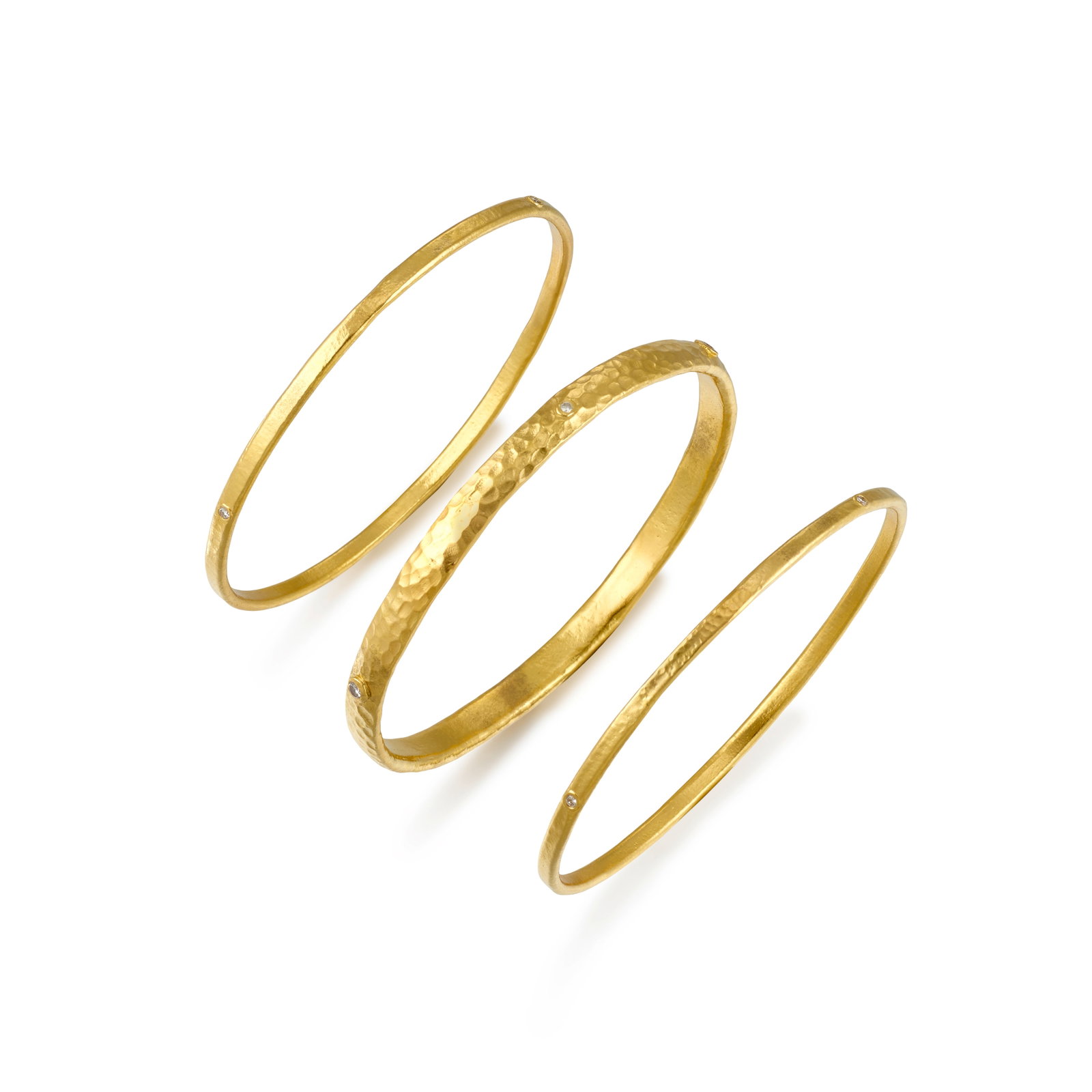 A SET OF GOLD AND DIAMOND BRACELETS (1 of 1)