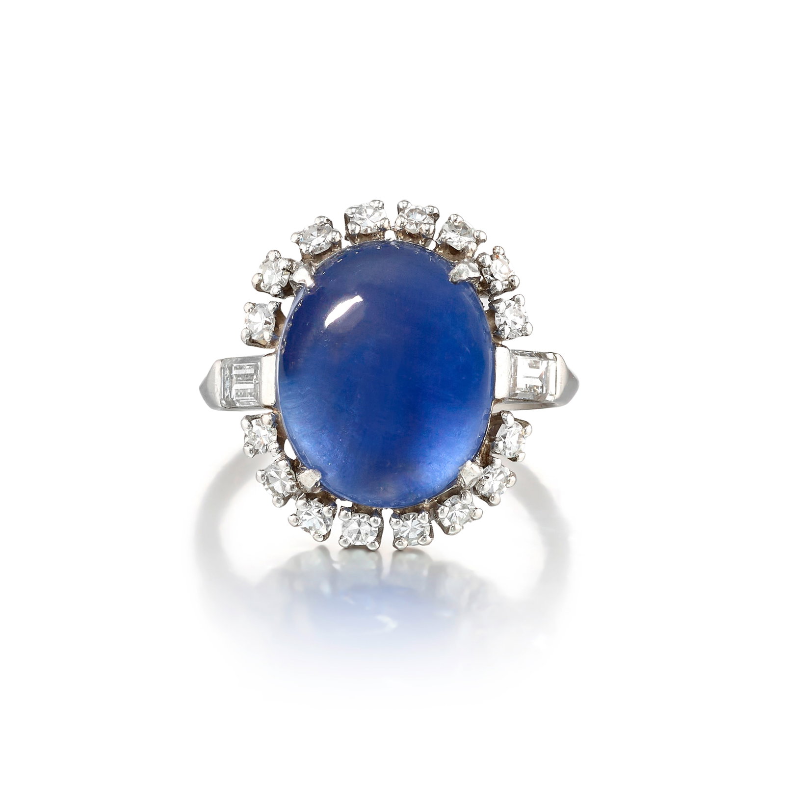 A PLATINUM, STAR SAPPHIRE AND DIAMOND RING: A PLATINUM, STAR SAPPHIRE AND DIAMOND RING Centering an oval-shaped cabochon star sapphire, in a surround of single and baguette-cut diamonds; with maker's mark 'MS BOWMAN'; estimated star sapphire we