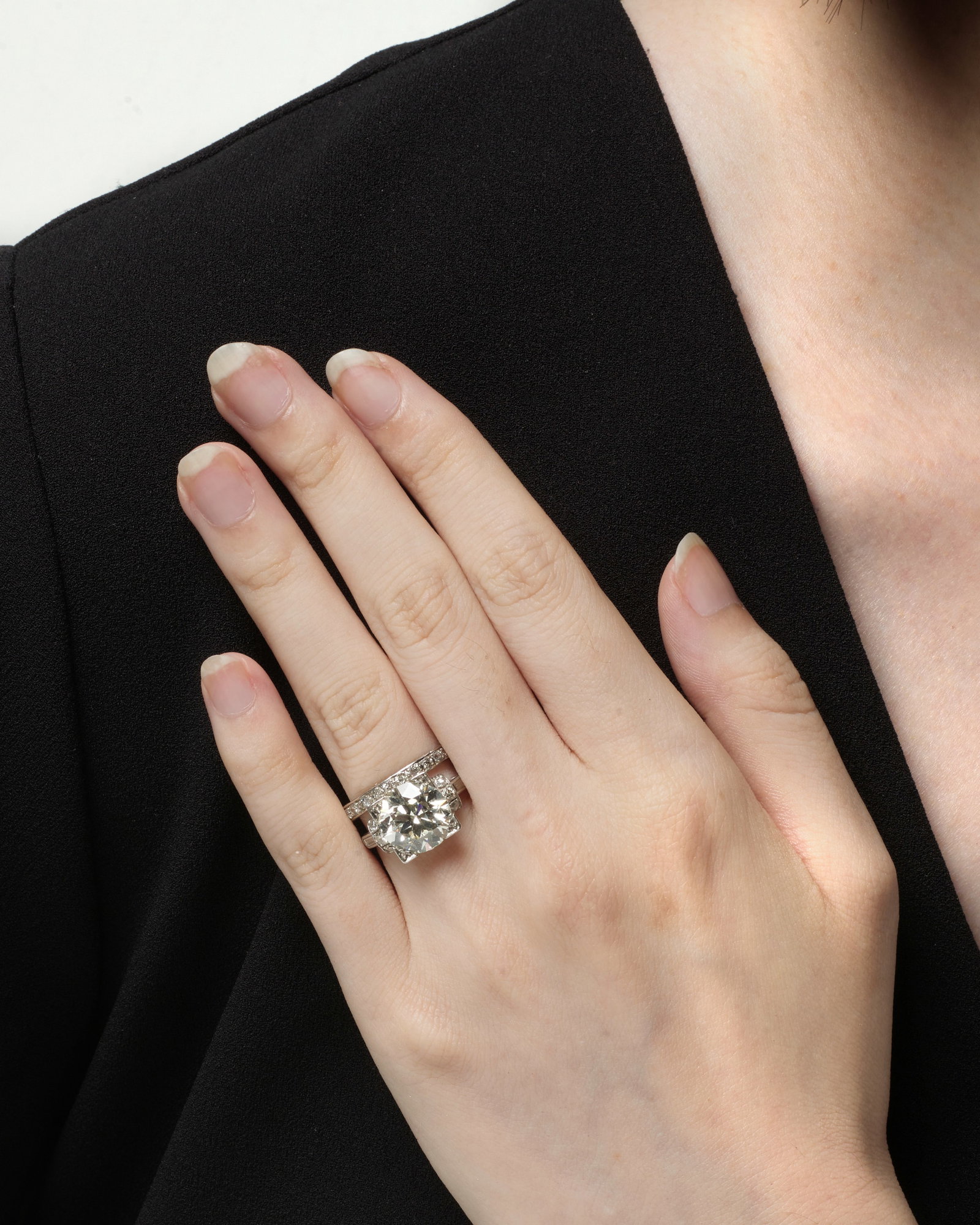 A SET OF DIAMOND RINGS, CIRCA 1910: A SET OF DIAMOND RINGS, CIRCA 1910 One ring centering a circular brilliant-cut diamond weighing 4.24 carats, accented by single and baguette-cut diamonds, together with an eternity band comprising