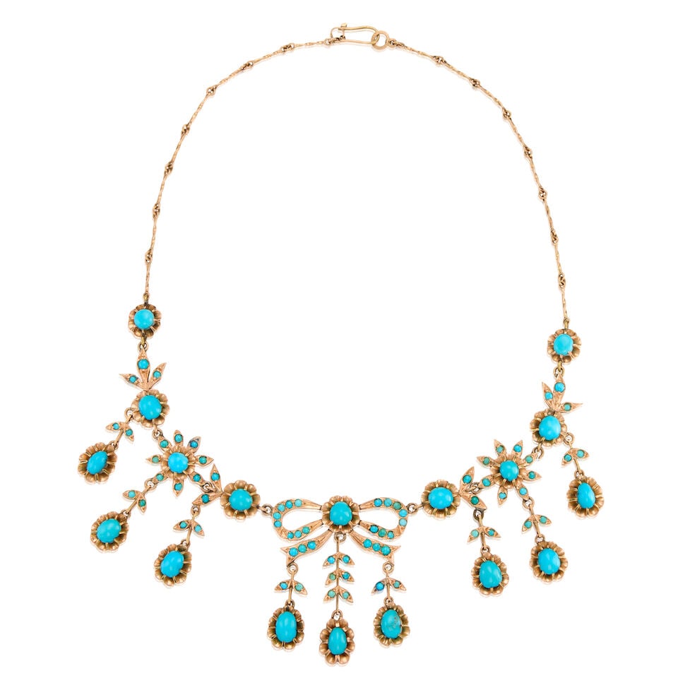 A VINTAGE GOLD AND TURQUOISE NECKLACE: A VINTAGE GOLD AND TURQUOISE NECKLACE • 13K and 14K yellow gold • Numerous cabochon-shaped turquoise in various shapes and sizes measuring from 2.17mm to 7.51mm in diameter • Length 