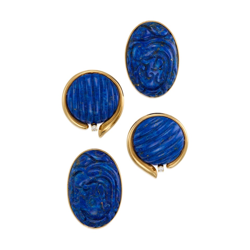 TWO PAIRS OF GOLD AND LAPIS LAZULI EARRINGS: TWO PAIRS OF GOLD AND LAPIS LAZULI EARRINGS • A pair of 14K yellow gold earrings with two carved cabochon lapis lazuli measuring approximately 29.53mm x 20.81mm x 6.72mm, measures 1 1/4 in. x