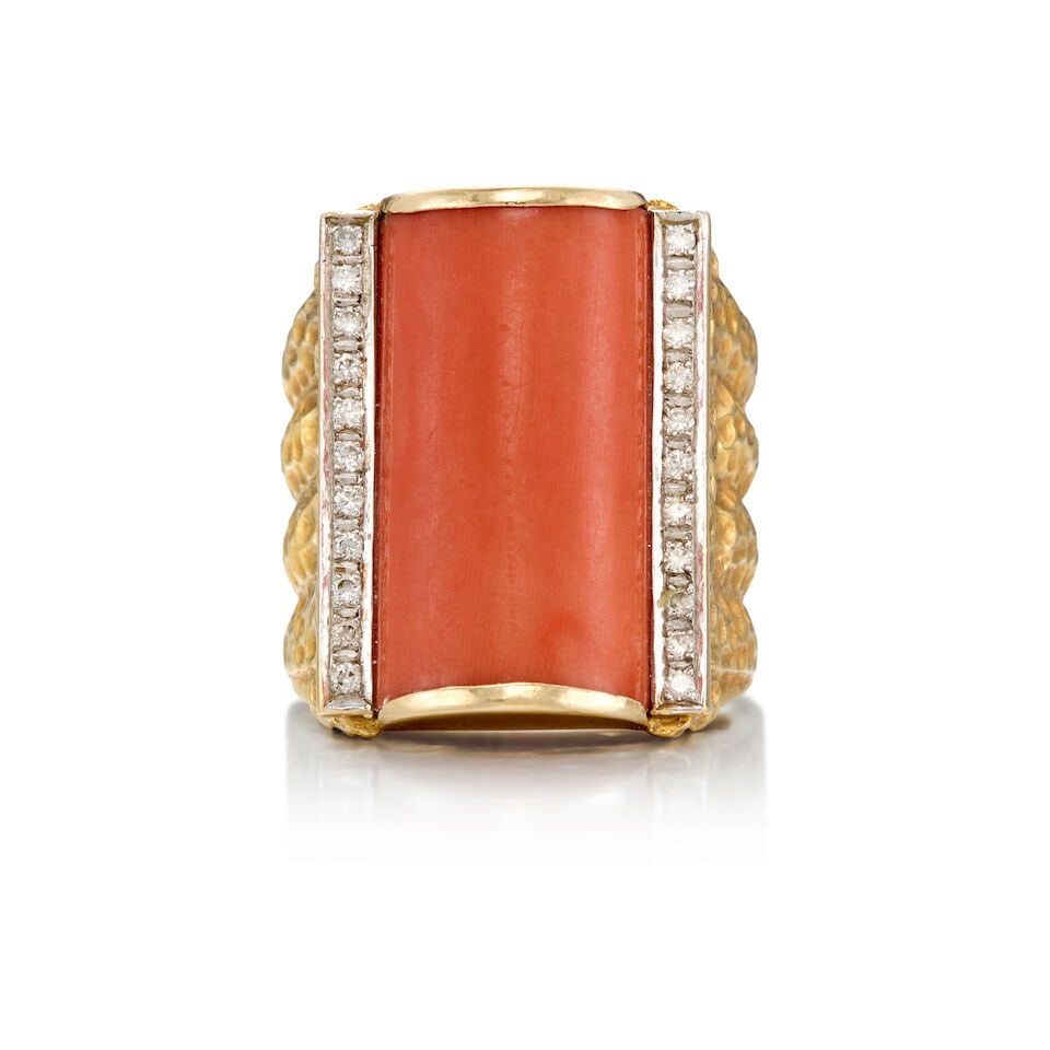 14K YELLOW GOLD, CORAL, AND DIAMOND RING: 14K YELLOW GOLD, CORAL, AND DIAMOND RING • A rectangular shaped cabochon coral measuring approximately 20.88mm x 12.35mm x 5.12mm • Twenty-two round shaped diamonds weighing approximately