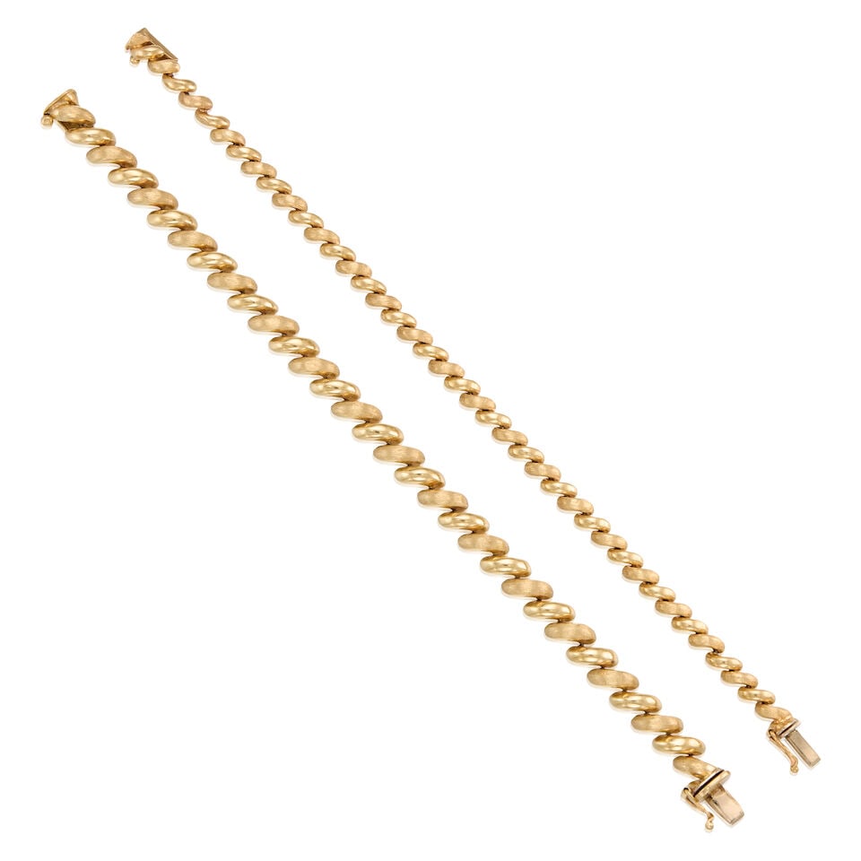 TWO YELLOW GOLD LINK BRACELETS: TWO YELLOW GOLD LINK BRACELETS • A 14K yellow gold bracelet, length 7 1/4 in. • A 14K yellow gold bracelet, length 7 1/2 in. • Estimated gross weight: 23.5 grams Footnotes: OVERALL