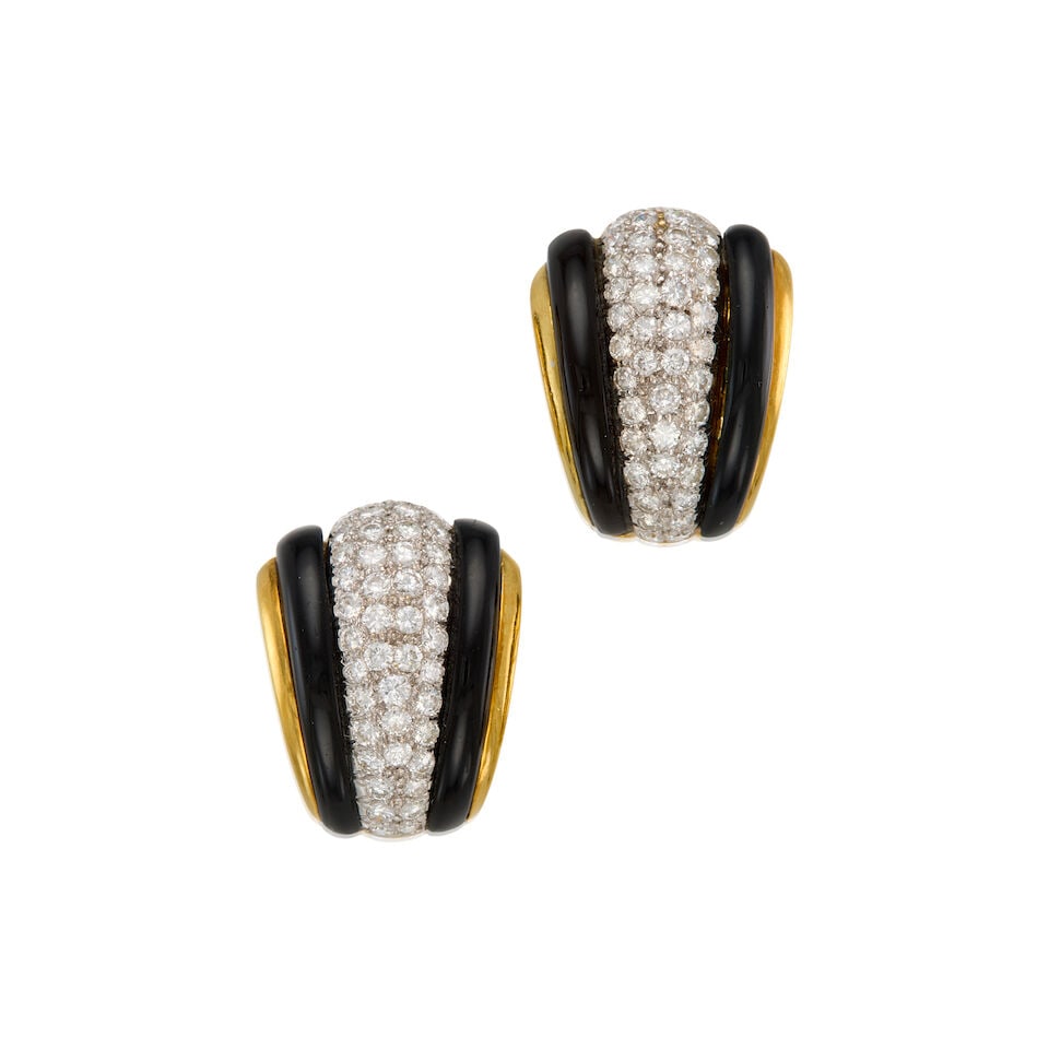 GOLD, ONYX, AND DIAMOND EARCLIPS: GOLD, ONYX, AND DIAMOND EARCLIPS • 18K yellow gold earrings with 14K yellow gold backings • Four carved onyx pieces measuring approximately 21.80mm x 3.62mm • Numerous round brillian