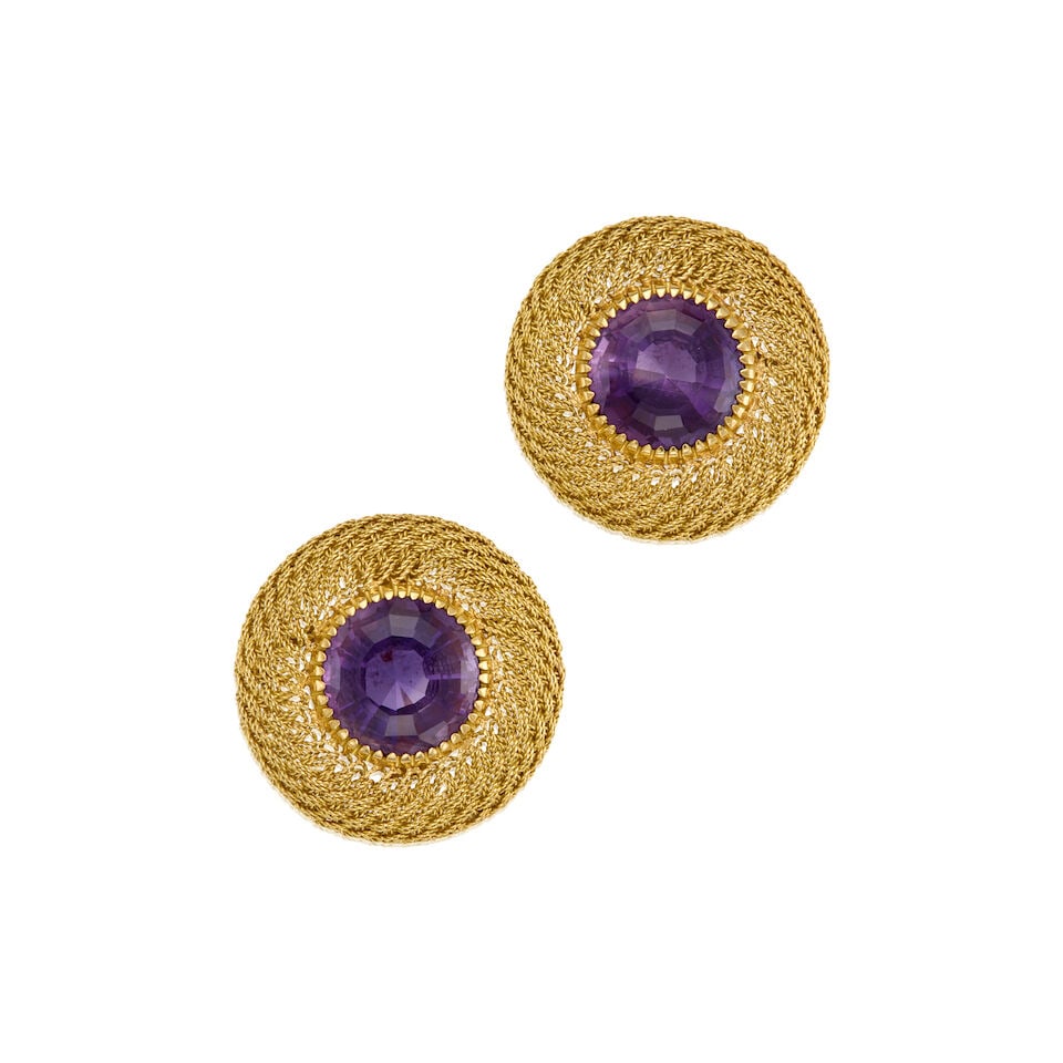 GOLD AND AMETHYST EARRINGS: GOLD AND AMETHYST EARRINGS • 18K yellow gold earrings with 14K white gold backings • Two round shaped amethysts weighing approximately 13 carats total • Measures 1 in. x 1