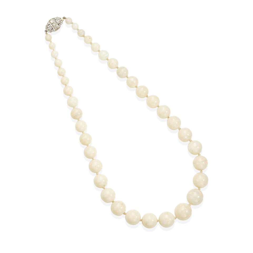 A DIAMOND AND OPAL NECKLACE: A DIAMOND AND OPAL NECKLACE • Platinum topped 14k white gold with a 16K white gold clasp • Numerous opal beads measuring approximately 6.82mm to 16.55mm in diameter • Numerous