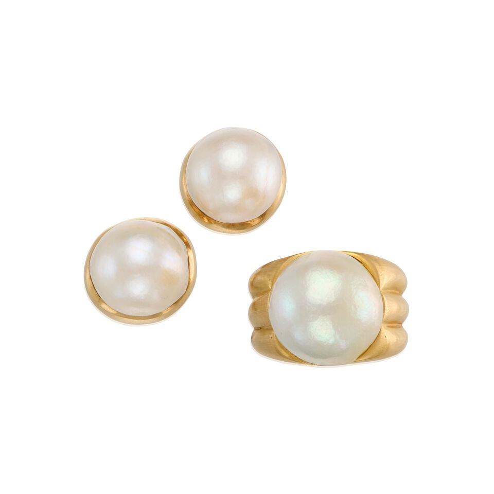 GOLD AND CULTURED PEARL RING AND EARRINGS: GOLD AND CULTURED PEARL RING AND EARRINGS • A pair of 14K yellow gold earrings with 18K yellow gold backings, with two cultured pearls measuring approximately 15.06mm in diameter, measures 5/8